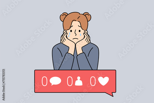 Girl is sad because of digital addiction and lack of subscribers and likes on social networks or personal blog. Crying child needs psychotherapy due to digital addiction causing depression
