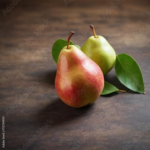 Ripe pears with leaves on wooden table.

