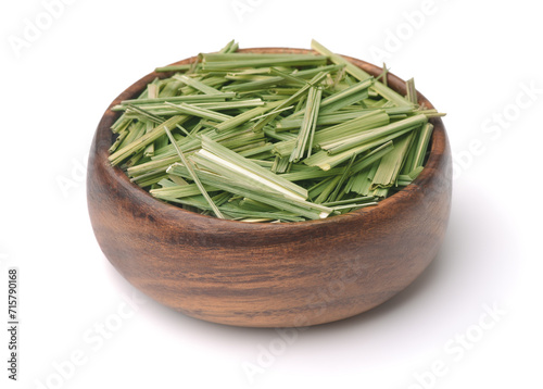 Dried lemongrass herb in wooden bowl