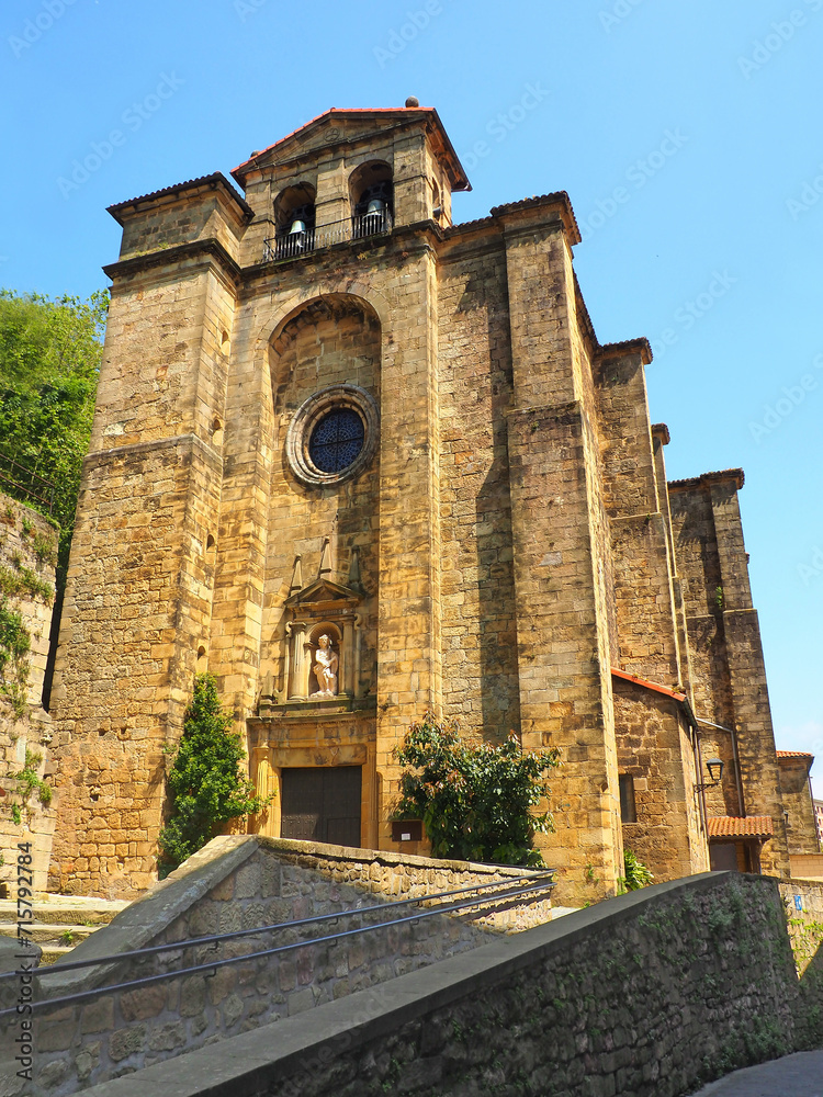 the superb San Juan Bautista church in Pasaia Donibane in the Basque Country dates from the 16th century. Made entirely of cut stone, it is decorated with a sculpture, topped with two bells.