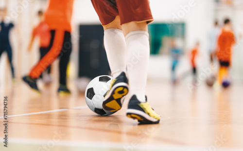 Players in Futsal Training. Indoor Soccer Class for Kids at School Sports Hall. Children Kicking Soccer Balls on Wooden Futsal Floor