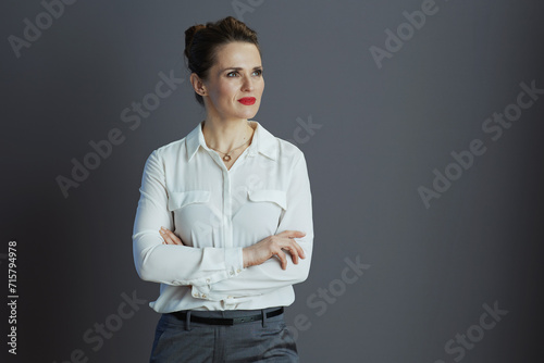 business owner woman looking at copy space isolated on grey
