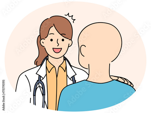 Smiling doctor help talk with cancer patient