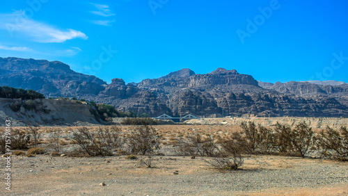 panoramic desert sand stone landcape Middle East view of dry contry side environment with mountains backround and bridge landmark object