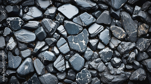  texture of dark gray stones with a white pattern, top view photo