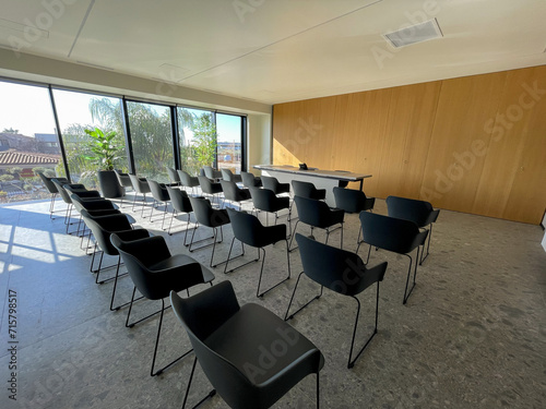 meeting room with positioned chairs and bright window