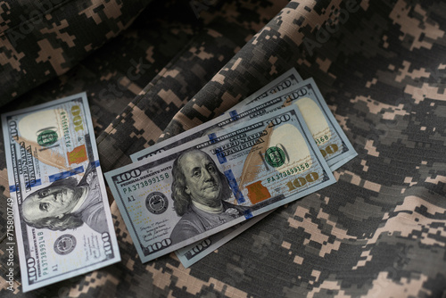 American dollars banknotes on military pixel background. photo