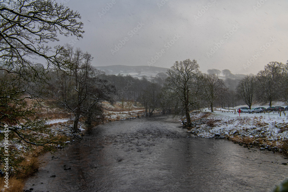 Skipton, North Yorkshire, 16th January 2024. Snow falls on Bolton Abbey in the Yorkshire Dales.