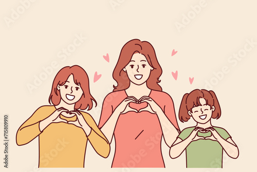 Congratulations on women day from women of different ages showing heart gesture and congratulating you on march 8th. Mom and daughters celebrate international women day or take pride in family unity