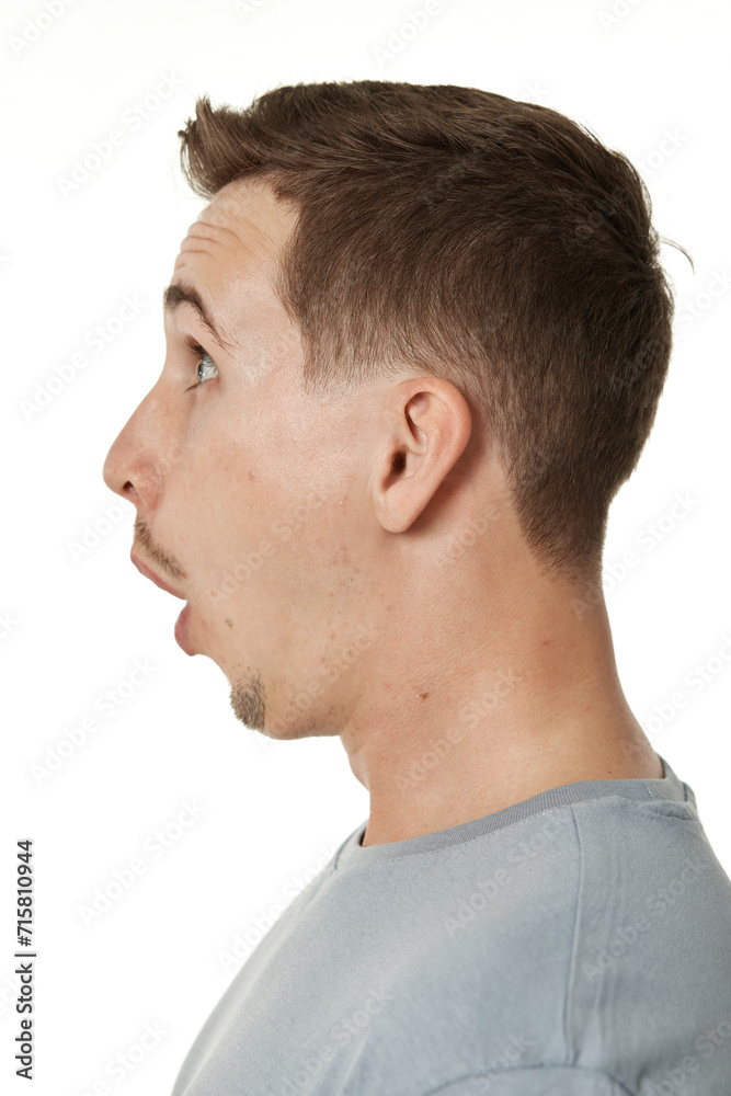 surprised guy looking at camera on white studio background surprised guy looking at camera on white studio background