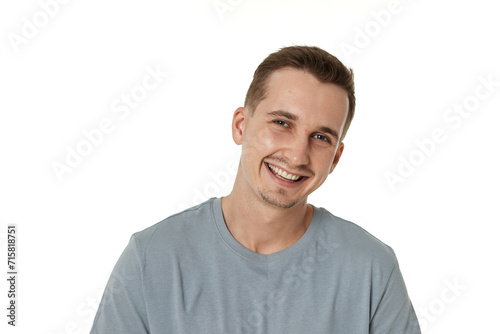 portrait of young smiling man on white background © producer