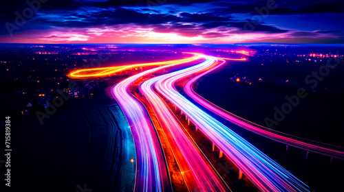Long exposure photo of highway at night with long exposure of light streaks. photo