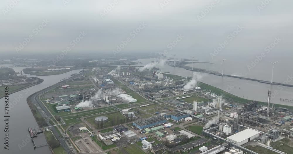 Chemical industry factory in the port of Delfzijl. Large silos containers and factory. Chemical industry factory in the port of Delfzijl. Large silos containers and factory.