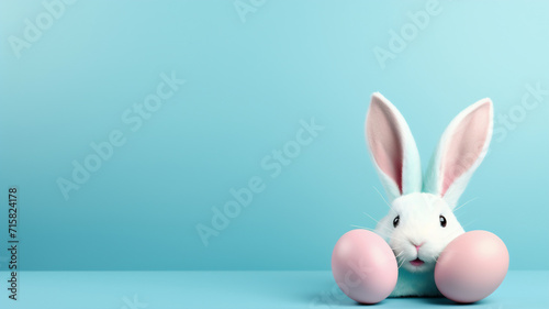 One pastel colored easter eggs and bunny ears on a isolated blue background 