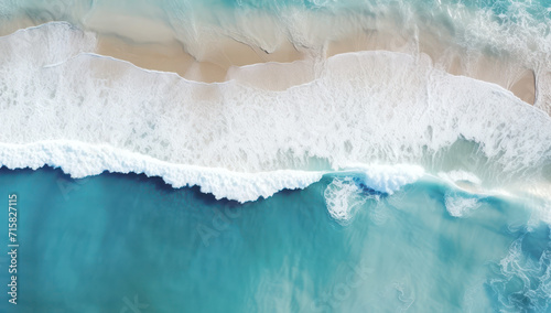 An aerial view of the ocean and sandy beach.