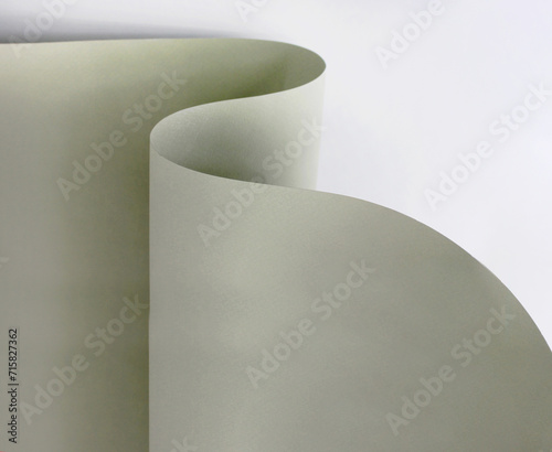 curved sheet of paper close-up. creative neutral background or texture