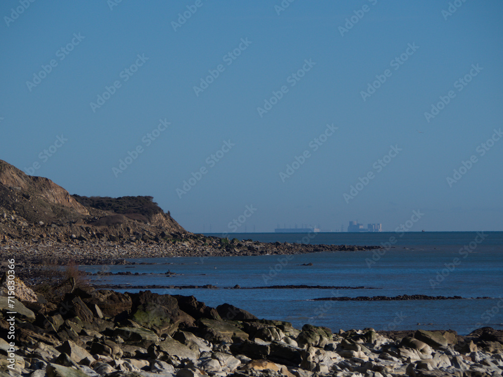 Hastings Cliffs and Dungeness Power Station in the distance.