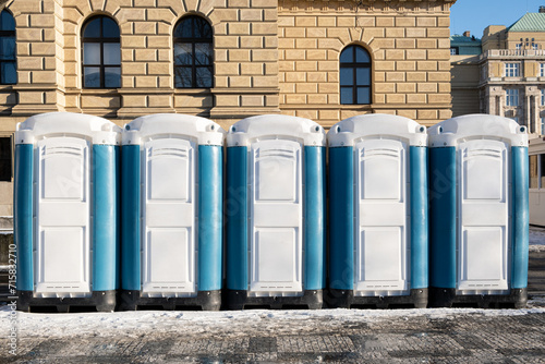 mobile bio WC  toilets made from plastic lined up in the city for public use.