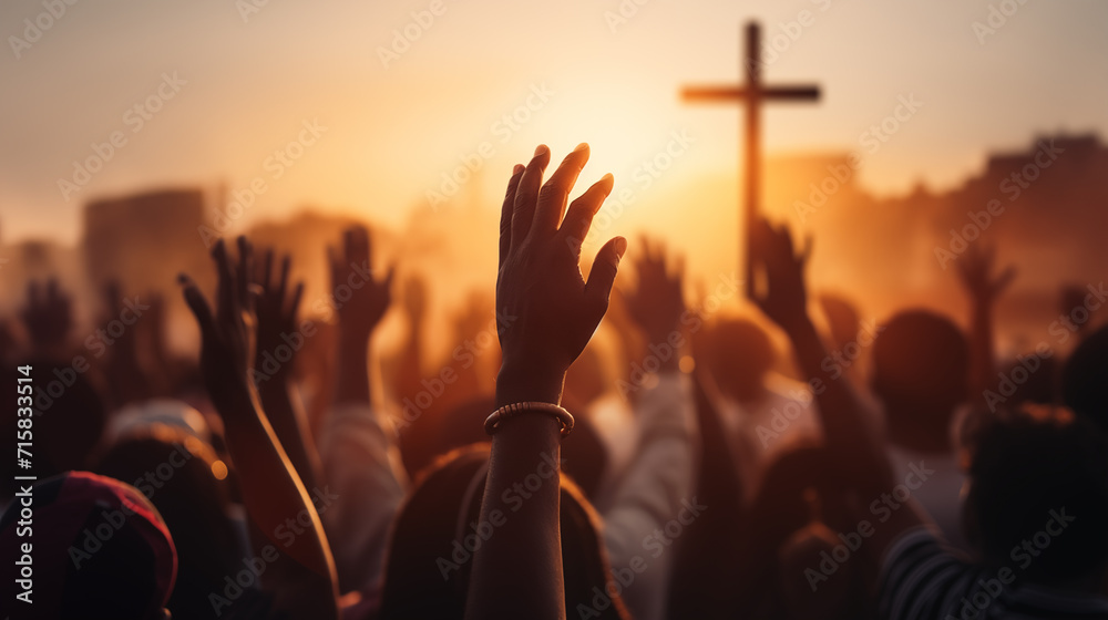 Christian worshipers raising hands up in the air in front of the cross - obrazy, fototapety, plakaty 