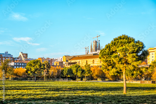 Konstfotografi Barcelona, Spain - December 21, 2023: A city park with La Sagrada Familia in the