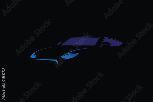 blue car in negative space on black background