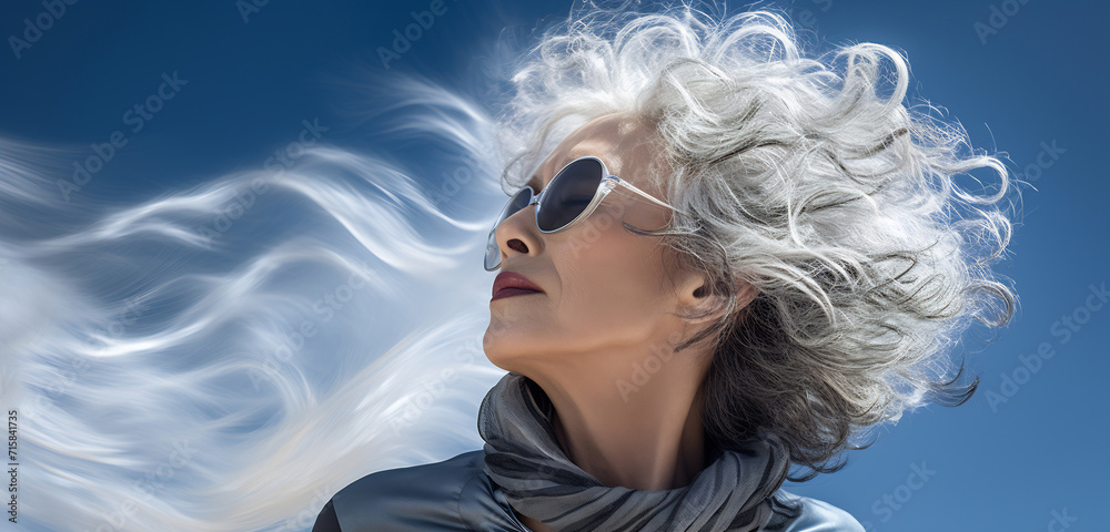 Stylish Woman with Flowing Grey Hair Stylish Woman with Flowing Grey Hair