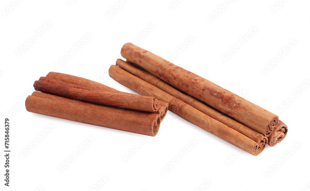 Dry aromatic cinnamon sticks isolated on white Dry aromatic cinnamon sticks isolated on white