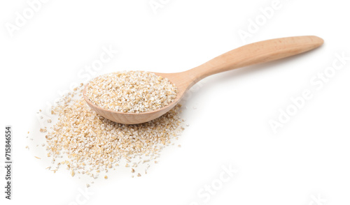 Spoon with raw barley groats isolated on white