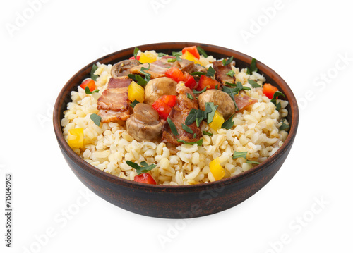 Cooked bulgur with vegetables, fried bacon and mushrooms in bowl isolated on white
