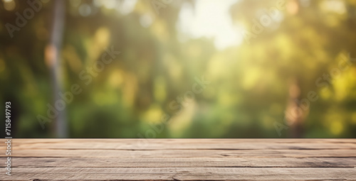 Warm sunlight filters through a blurred forest scene behind a smooth, empty wooden table surface. 
