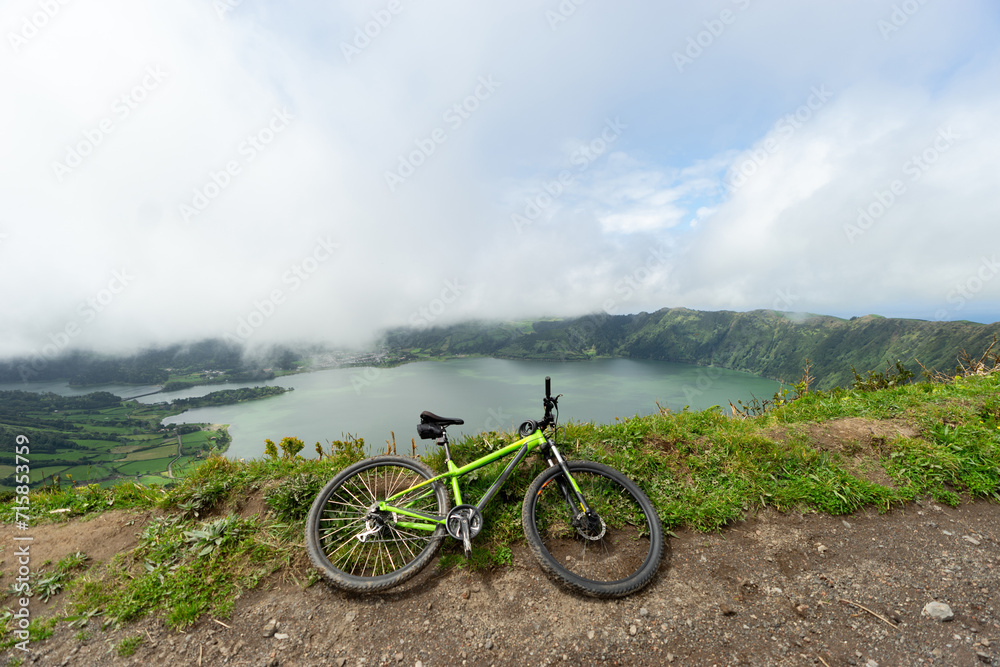 bicycle against the background of a volcanic lake lagoa azul on the island of Sao Miguel, Azores bicycle against the background of a volcanic lake lagoa azul on the island of Sao Miguel, Azores
