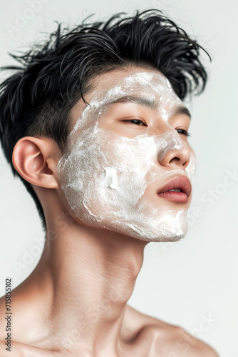 Man with moisturizing face mask, Grooming and Daily masculine Skincare Routine Concept