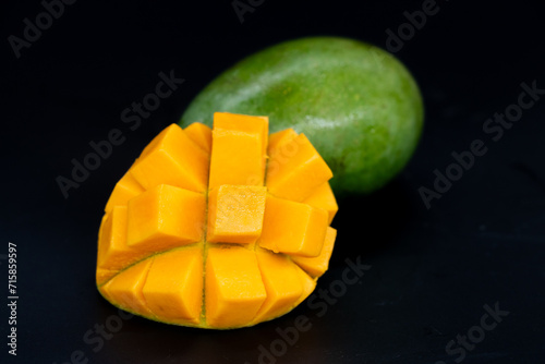Mango slices isolated on the black background.