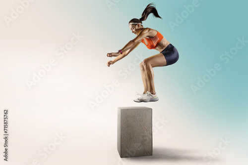 Sporty young girl is training, jumping on the bar. photo
