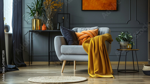 An artfully arranged living room featuring a plush armchair adorned with a stylish blanket, complementing the color scheme and enhancing the overall aesthetic. The visual harmony c