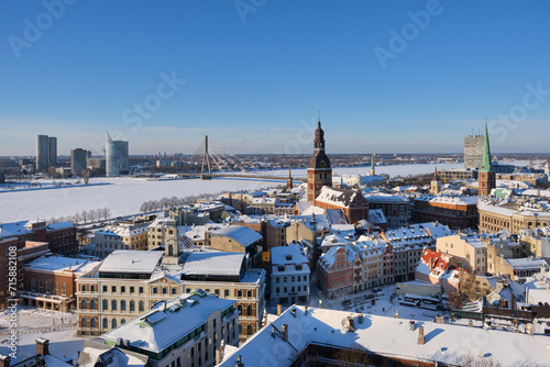 Panoramic view from tower of Saint Peters Church on Riga Cathedral and roofs of old houses in old city of Riga, Latvia in winter.