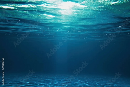 Abyssal Depths: View of Dark Blue Ocean Surface from Underwater photo