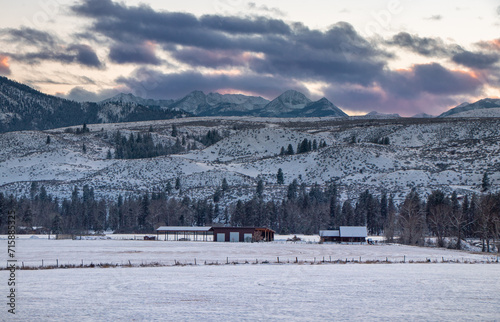 Beautiful Snow-covered winter landscape with the majestic North Cascades in the background at dusk - Twisp, Methow Valley, Washington, USA