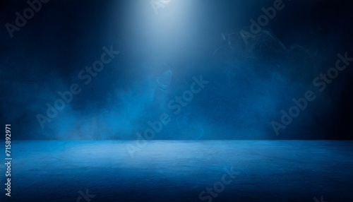 the dark stage shows dark blue background an empty dark scene neon light and spotlights the concrete floor and studio room with smoke float up the interior texture for display products
