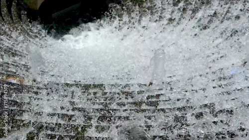 Close-up of falling crystal water. Slow motion. High quality 4k footage photo