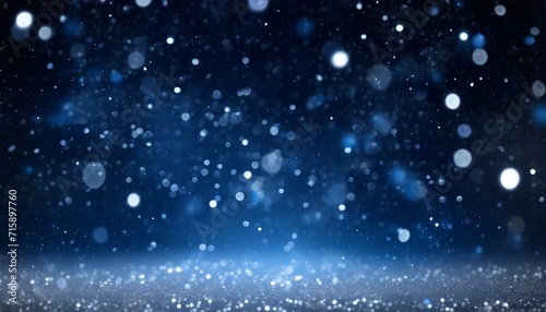 glowing in the dark defocused glitter texture with blue bokeh lights and snow christmas and winter holidays background