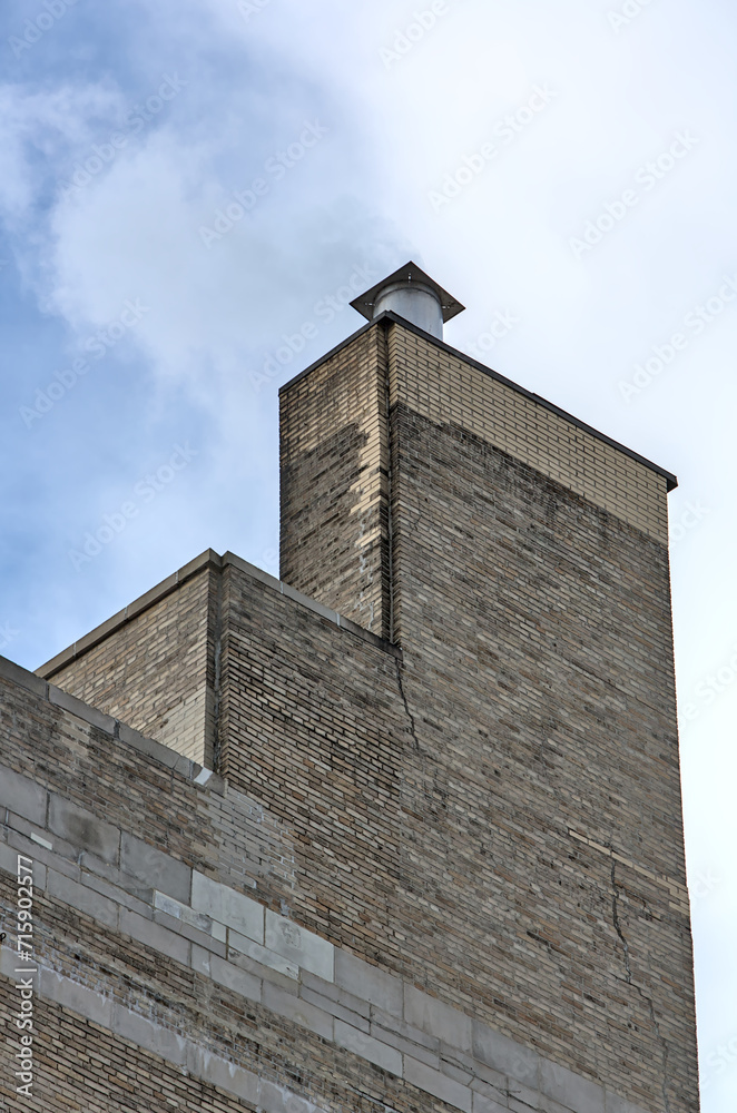 tall urban brick building chimney top detail (residential house in ...