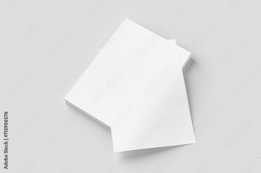 Cv, resume, letterhead, invoice mockup. Stack of A4 papers on a grey background. Cv, resume, letterhead, invoice mockup. Stack of A4 papers on a grey background.