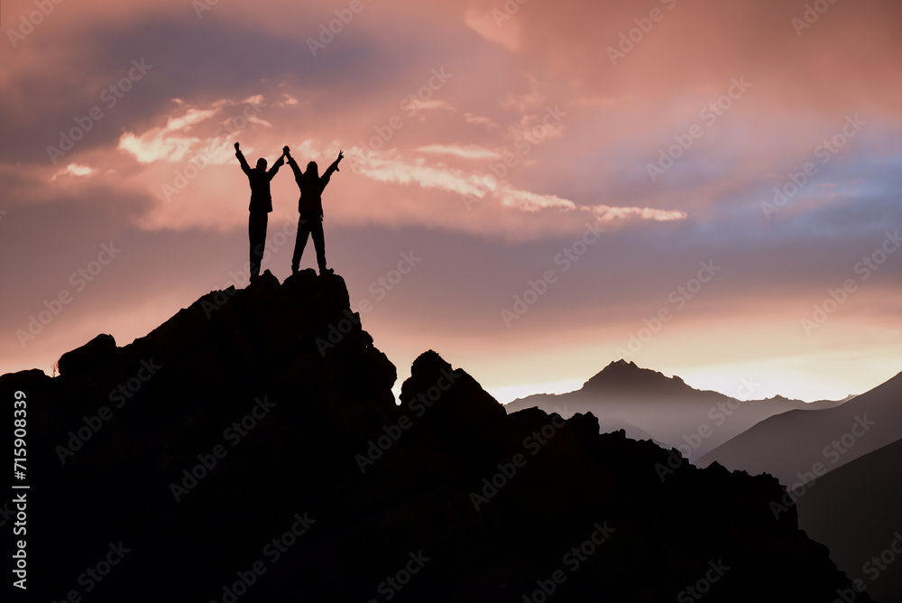 The successful climb and joy of victory of the two climbers at the top