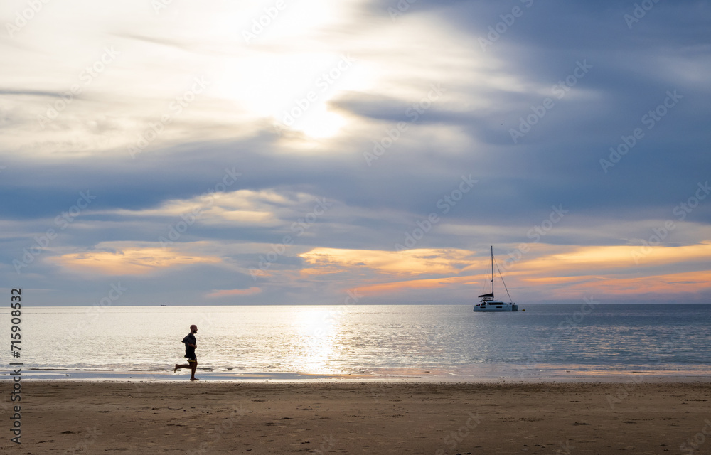 Landscape horizon panorama summer look man person run jogging exercise on sea sand beach wind wave cool holiday calm sunset sky evening day time calm nature tropical beautiful ocean water travel