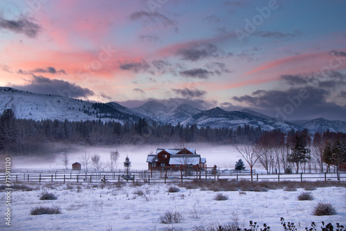Old Wooden Farm House in the Mist at the Edge of an Evergreen Forest at Dusk - Methow Valley, Washington, USA (Winter)	