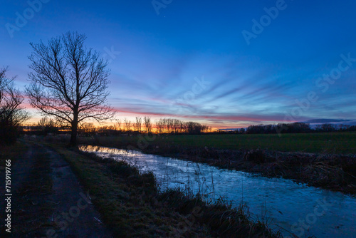 Blue hour after sunset over a water canal. Night shot.