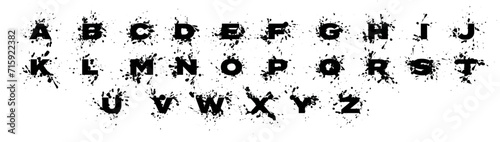 Splatter alphabet: Uppercase sans-serif letters with liquid ink drops.