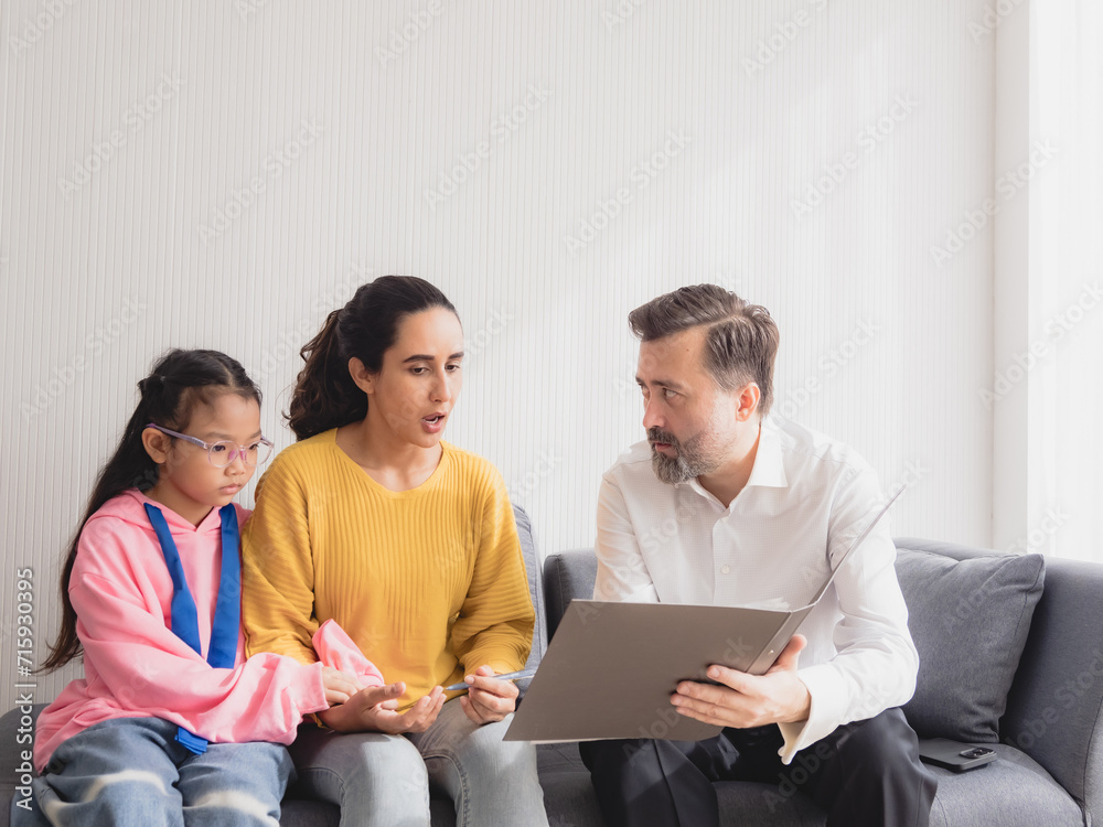 Portrait latin woman and daughter sit sofa with man business caucasian sitting two pason talk giving advice and think analyze look insurance, investment and financial documents in agreement in room Portrait latin woman and daughter sit sofa with man business caucasian sitting two pason talk giving advice and think analyze look insurance, investment and financial documents in agreement in room