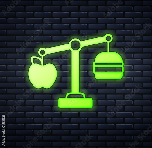 Glowing neon Calorie calculator icon isolated on isolated on brick wall background. Calorie count. Diet. Weight loss. Portion control. Healthy eating. Dietary nutrition. Vector